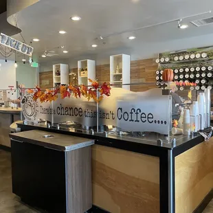 a coffee shop with a counter