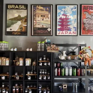 a coffee shop with posters on the wall