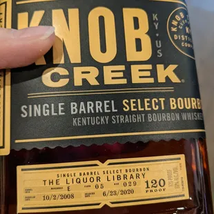 a bottle of knob creek single barrel select bourbon
