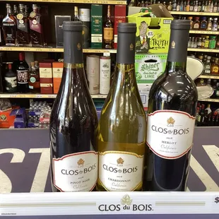 three bottles of wine on display