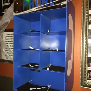 Old school phone booth repurposed to charge most major cell phones