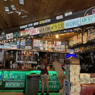 a man standing in front of the bar