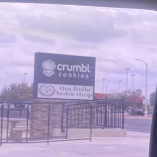 Outdoor sign, go in parking lot of crumbl
