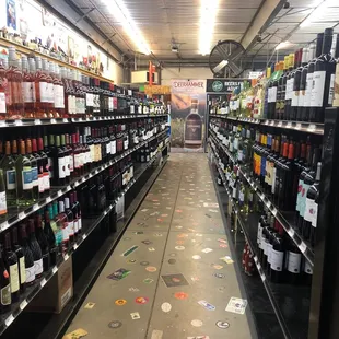 the aisle of a liquor store