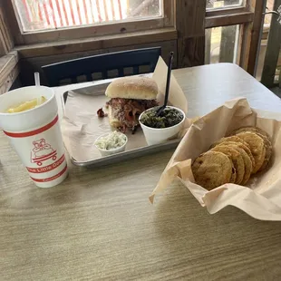 The Pig Boss, turnip greens, coleslaw, and fried green tomatoes