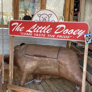 a wooden pig statue