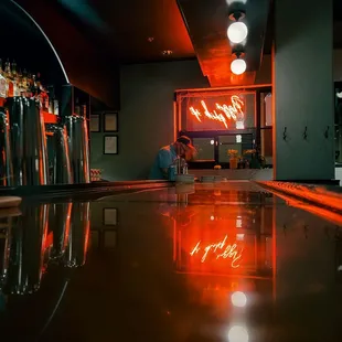 a bar with a neon sign