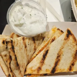 Side of pita chips. Nice homemade Tzatziki sauce. Delicious!