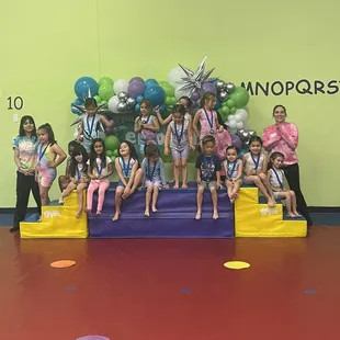 Receiving medals for their performance.