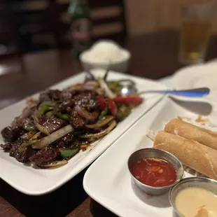 Shaken beef (?) and egg rolls