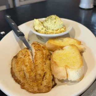 Grilled fish, potato salad and bread and gumbo not pictured