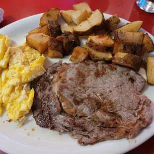 Hungry prospector with American fries and scrambled eggs