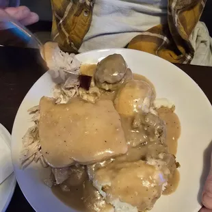 Open Faced Turkey Sandwich with Mashed Potatoes, Stuffing and Cranberry Sauce.