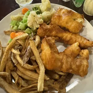 3 piece fish fry with French fries and vegetables