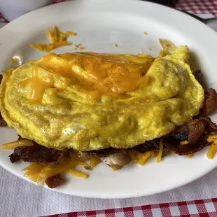Senior 2 egg omelet filled with bacon, cheddar and mushrooms