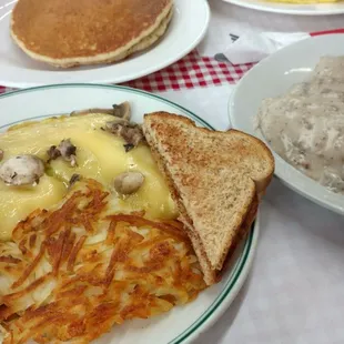 Mushroom &amp; Swiss omlette a short stack of pancakes and biscuits and gravy!!