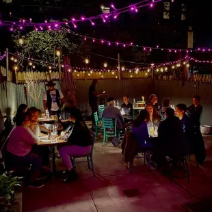 a group of people sitting around a table