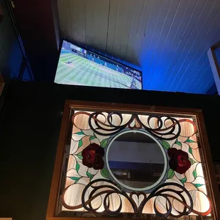 a stained glass window with roses