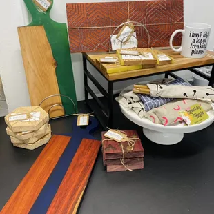 Handmade charcuterie boards, coasters, reusable utensil set.
