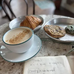 a cup of coffee and cookies