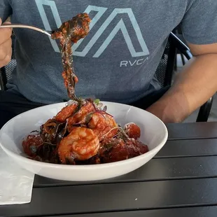 a man eating a bowl of food