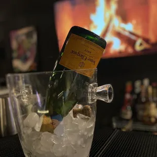 a bottle of champagne in an ice bucket