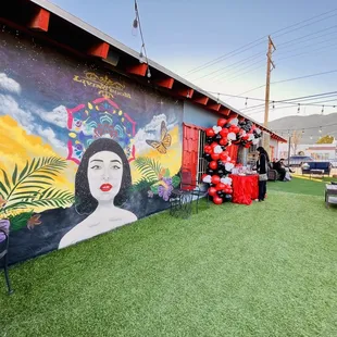 a mural of a geisha woman