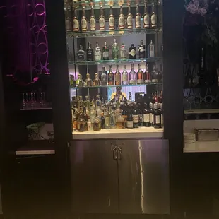 a bar with a lot of bottles
