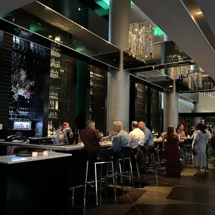 people sitting at the bar