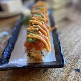 K. I. G. - Spicy crab, cream cheese, shrimp, tempura, spicy, tuna, jalapeño, Sriracha, areola, and eel sauce. $17