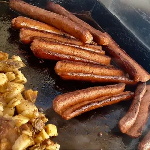 a bunch of sausages on a grill