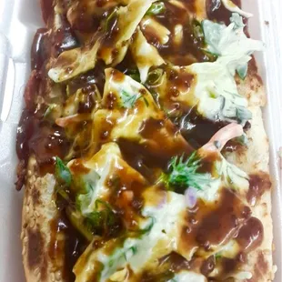 a hot dog in a styrofoam container