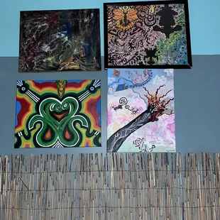 a variety of paintings on the wall