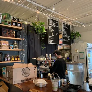 a man working at a coffee shop