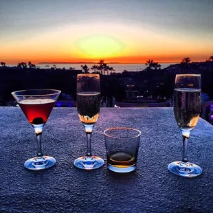 three glasses of wine on a table