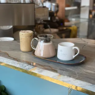 two cups of coffee on a counter