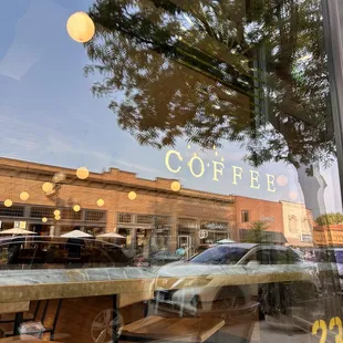 a reflection of a car in the window