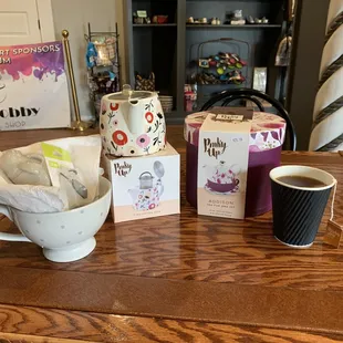 a cup of coffee and a gift bag
