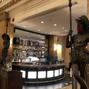 a statue of a woman holding a staff