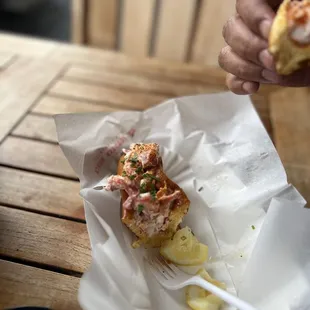 a person holding a piece of food