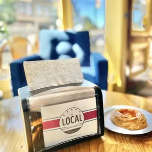 a plate of pastries and a bagel on a table