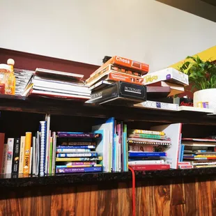 Shelf of games and books for community use