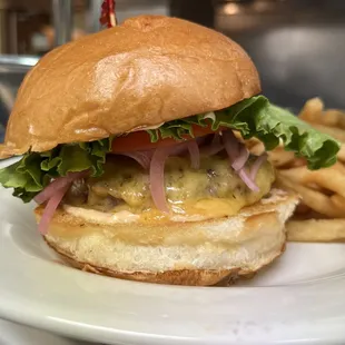 ATX Classic: 1/3 lbs all Texas Beef, Tillamook Sharp Cheddar, Classic Sauce on a Potato Bun - with Herbed Fries.