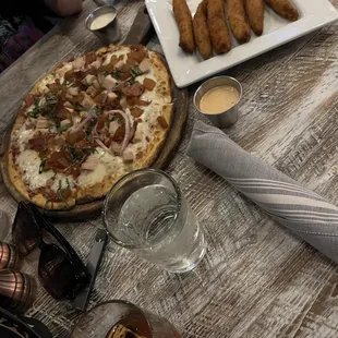 a pizza and beer on the table