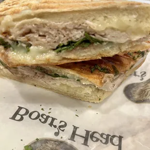 Turkey &amp; Brie: roasted turkey, melted brie cheese, arugula &amp; cranberry chutney on panini pressed french roll.