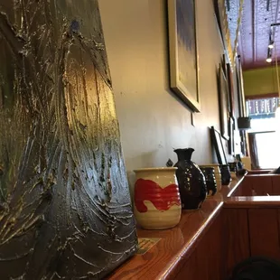 Locally made pottery, local art, and a red painted ceiling. What could be better?