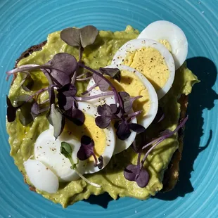 Avocado toast - olive tempanade, avocado, hard boiled egg, organic greens - yum!