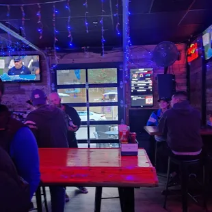 a group of people sitting at a bar