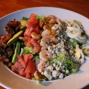 a plate of food on a wooden table