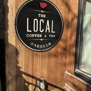 a sign for the local coffee and tea